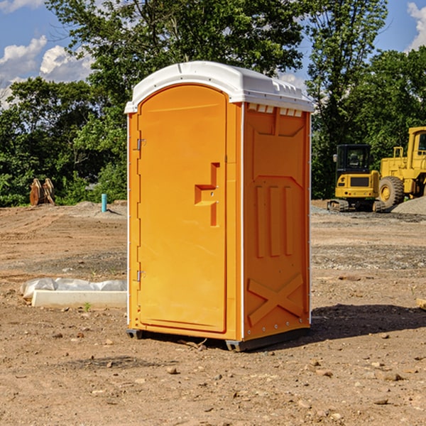 what is the cost difference between standard and deluxe portable restroom rentals in Wiota
